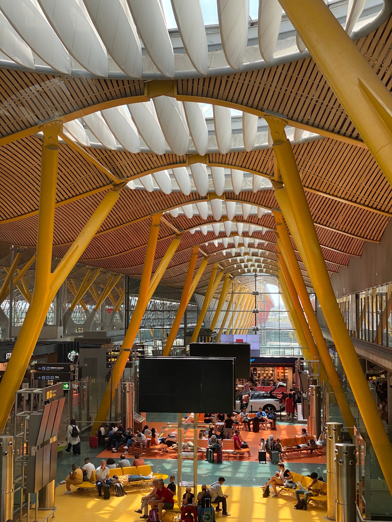 Modern Airport Terminal — Rooftop check-in: boarding passes and hotel keys, all on the phone.