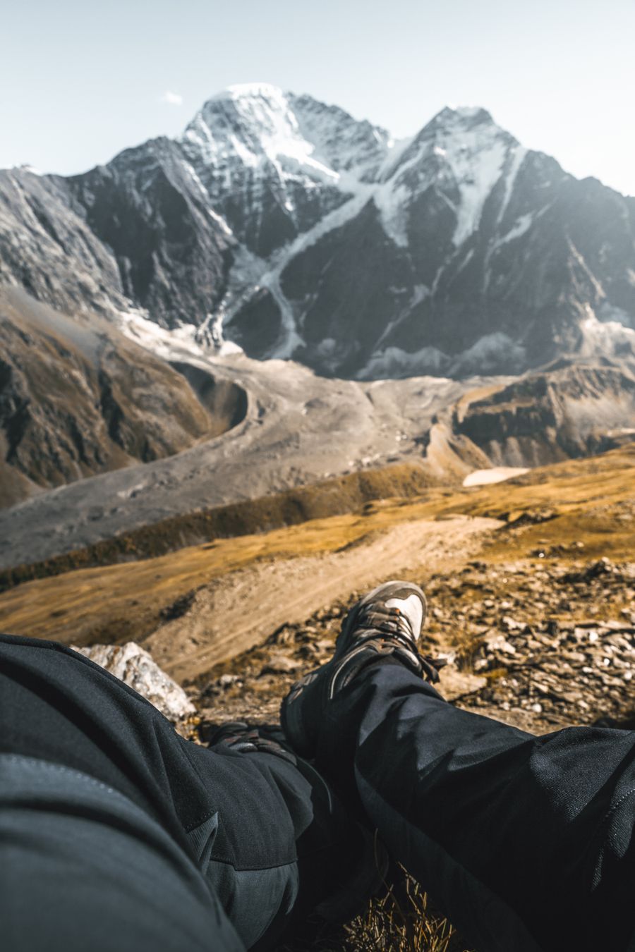 person sitting on a mountain — Airport Connectivity: the fastest way to turn a vague travel question into a next step.