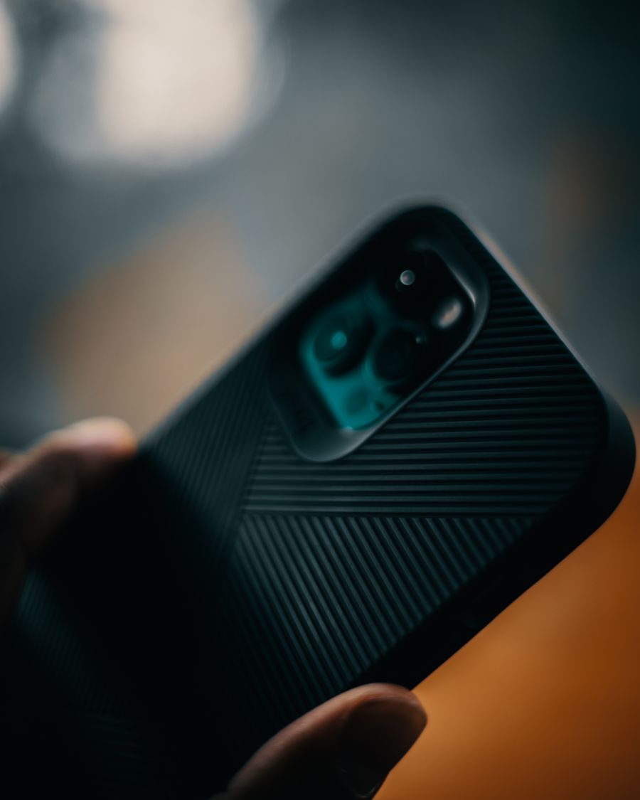 a person holding black smartphone — The red-eye recovery: hotel early-check-in arranged mid-flight.