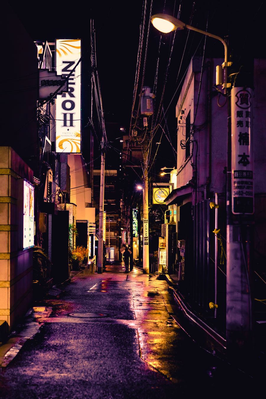 dark alley — City lights after dark — the eSIM doesn't care what time it is.