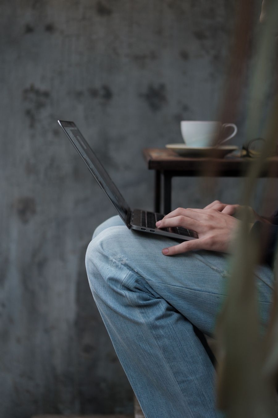 close up of man working on laptop