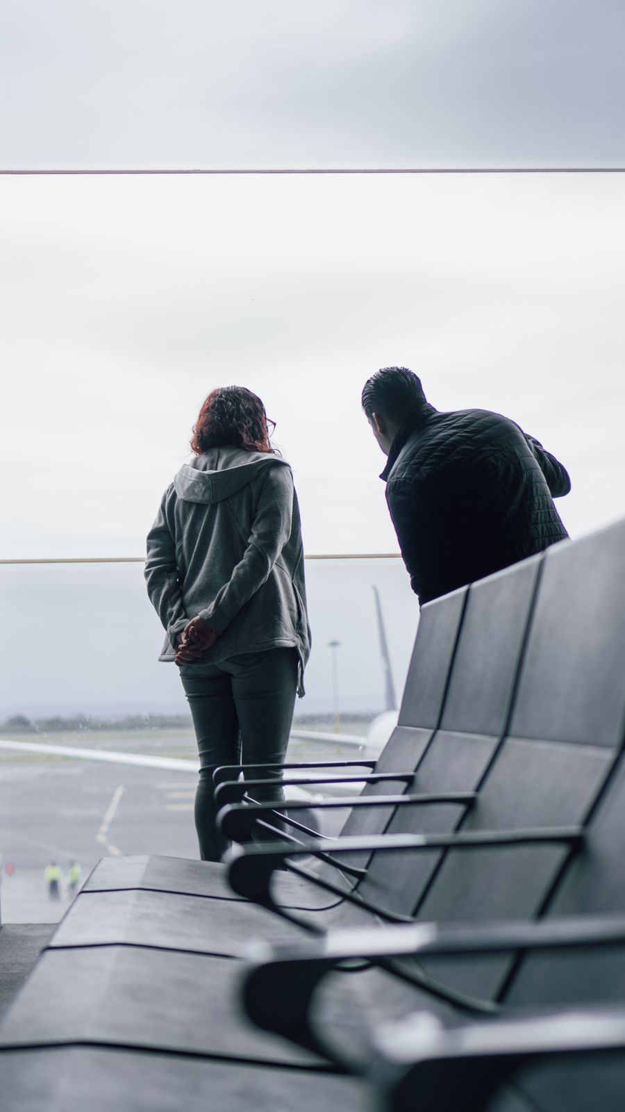 woman and man standing near windows on airport — From question to next step: DNS Leak Test shortens the path to a decision.