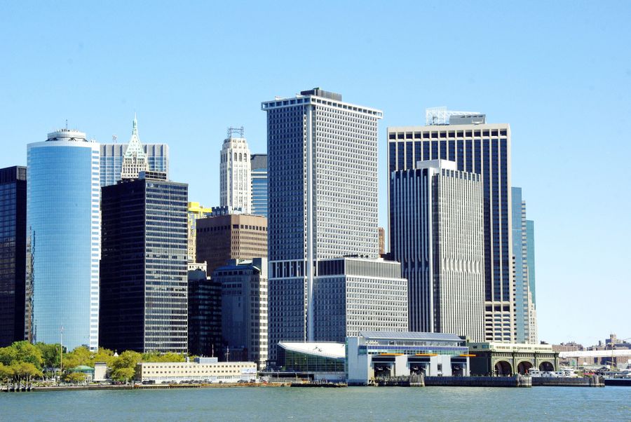 white and gray high rise buildings near body of water — Share the result — everyone plans from the same numbers.