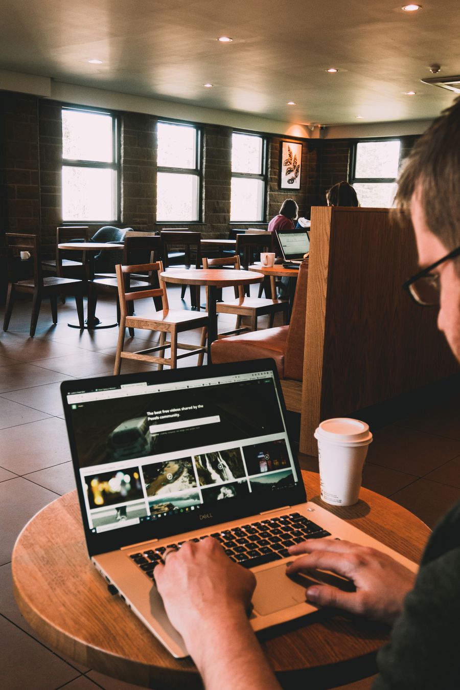 man using macbook on wooden table — From DNS Leak Test's answer to checkout is a short, well-lit path.