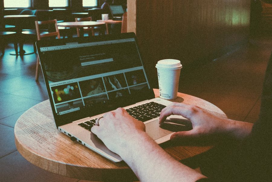 person typing on laptop computer
