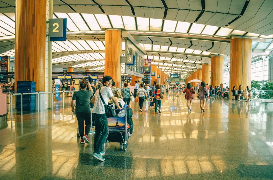 people standing inside airport — Docs: Installationsguides mit Screenshots von echten Handys, keine Renders.