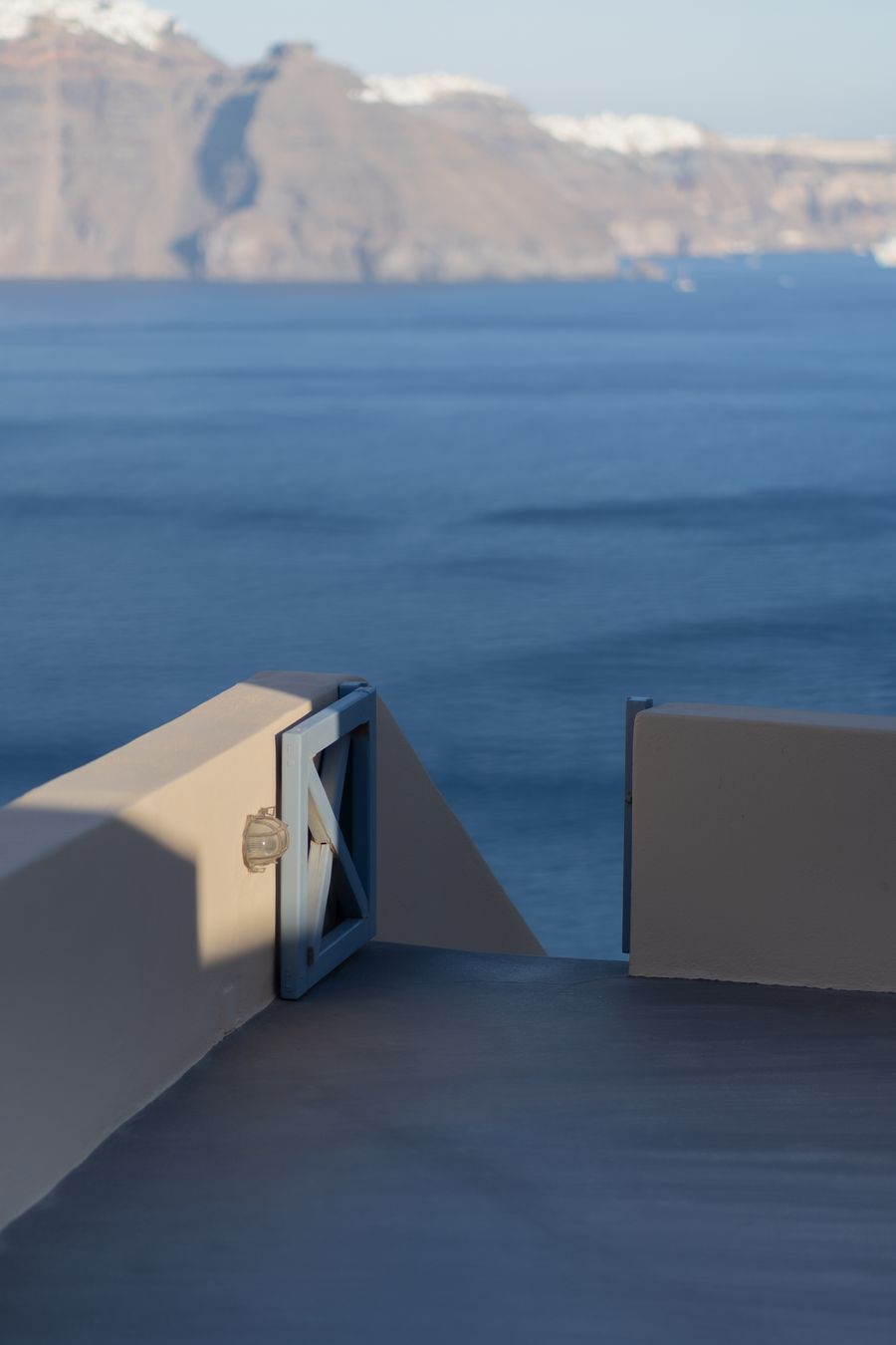 a view of the ocean from the balcony of a hotel