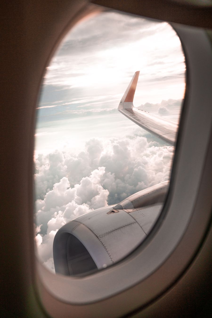 selective focus photo of airplane window — The rental desk handshake: confirmation email open, license photo ready.