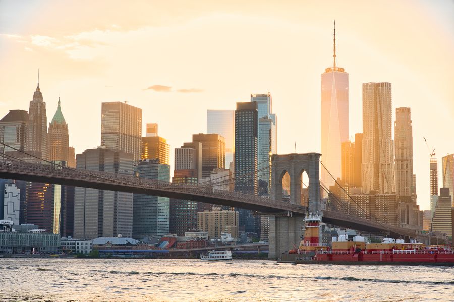 sunset over brooklyn bridge and nyc skyline — Café office: hotspot running, video call stable, no hotel Wi-Fi roulette.