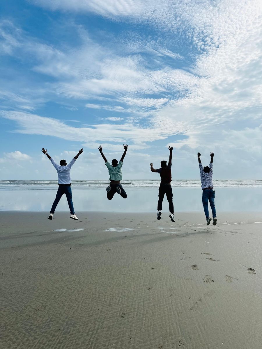 friends jumping together on a beach — Market mornings: look up the dish, translate the menu, pay by phone.