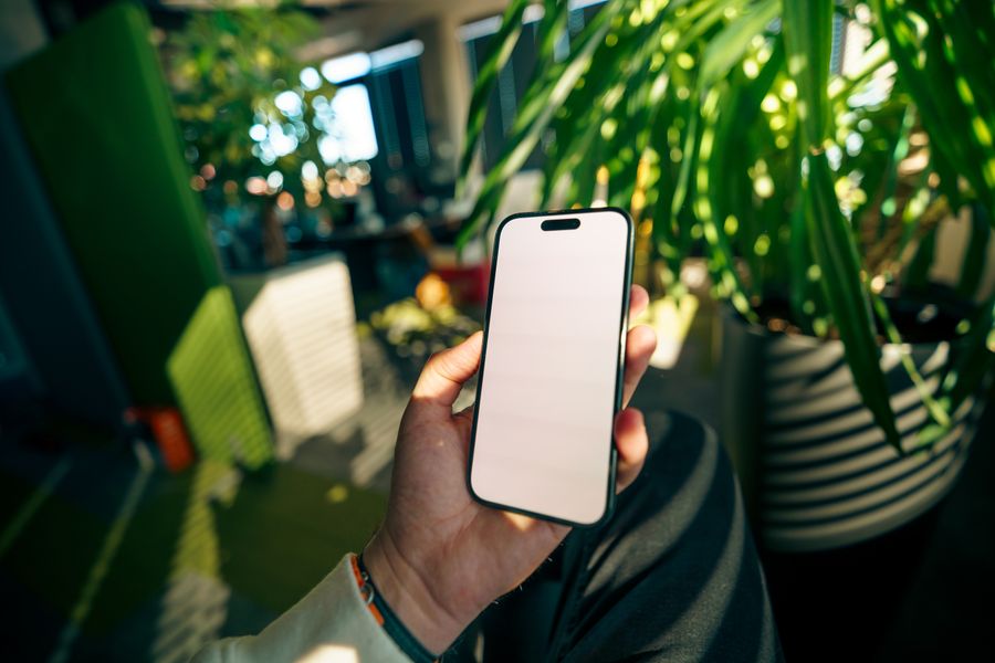 modern workspace with smartphone and greenery — The FAQ below Best Network by City answers the six questions everyone asks first.