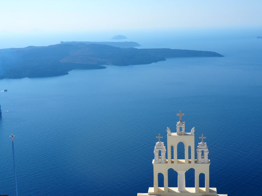 tower with crosses against island on lake — Find My Plan: tell it about the trip, get the answer in under a minute.