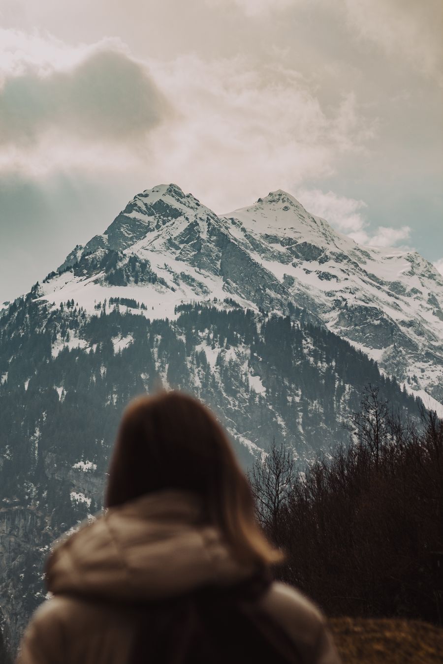 woman admiring snow capped mountain view — Resend eSIM QR Code runs in your browser session — nothing sensitive stored against you.