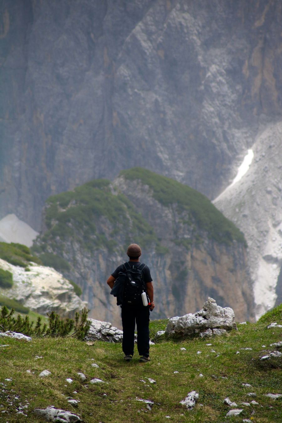 lone hiker exploring dolomite mountains landscape