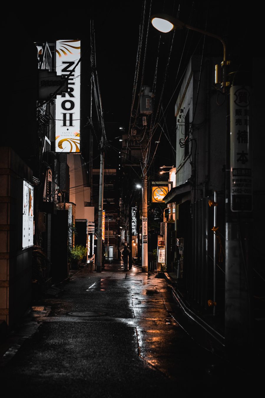 an empty street at night — The red-eye recovery: hotel early-check-in arranged mid-flight.