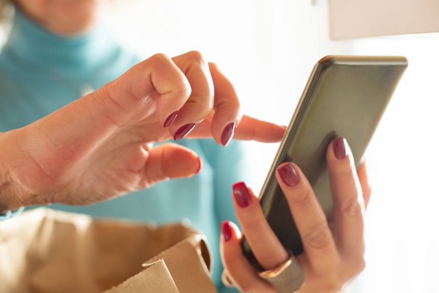 close up photo of person using smartphone — Family group chat: location shared, dinner plans settled in minutes.