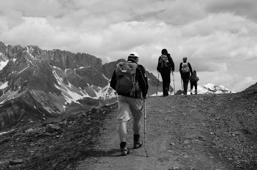 grayscale photo of people hiking on the mountain — The connected trip: maps, messages and translation, all on one eSIM.