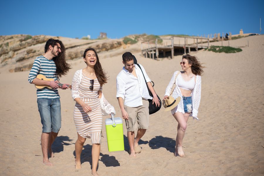 people walking on shore — Developers: Die Abflugtafel springt um: Gate gefunden, Lounge lokalisiert, alles auf der eSIM.
