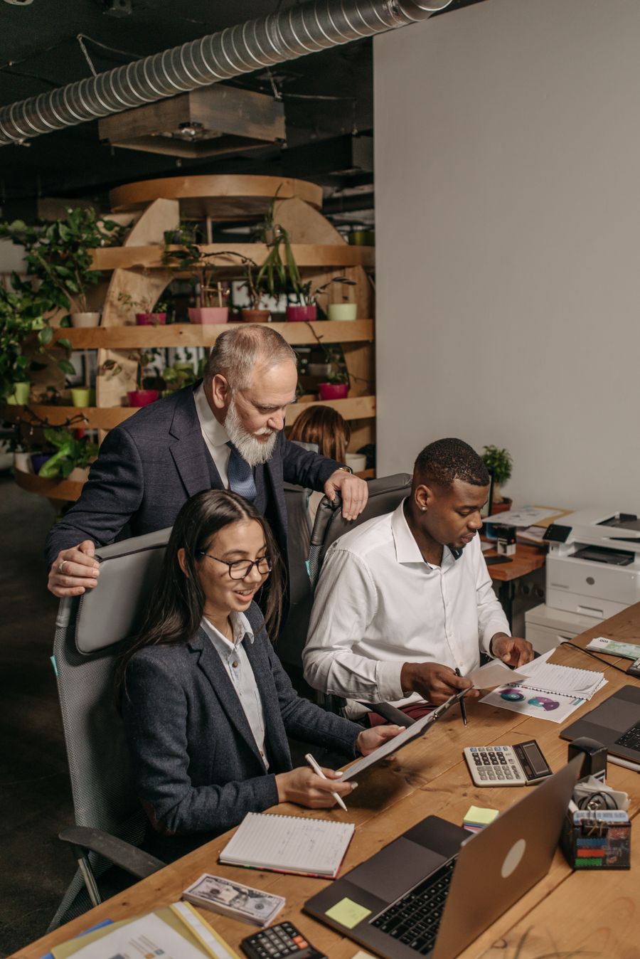 three people working in the office