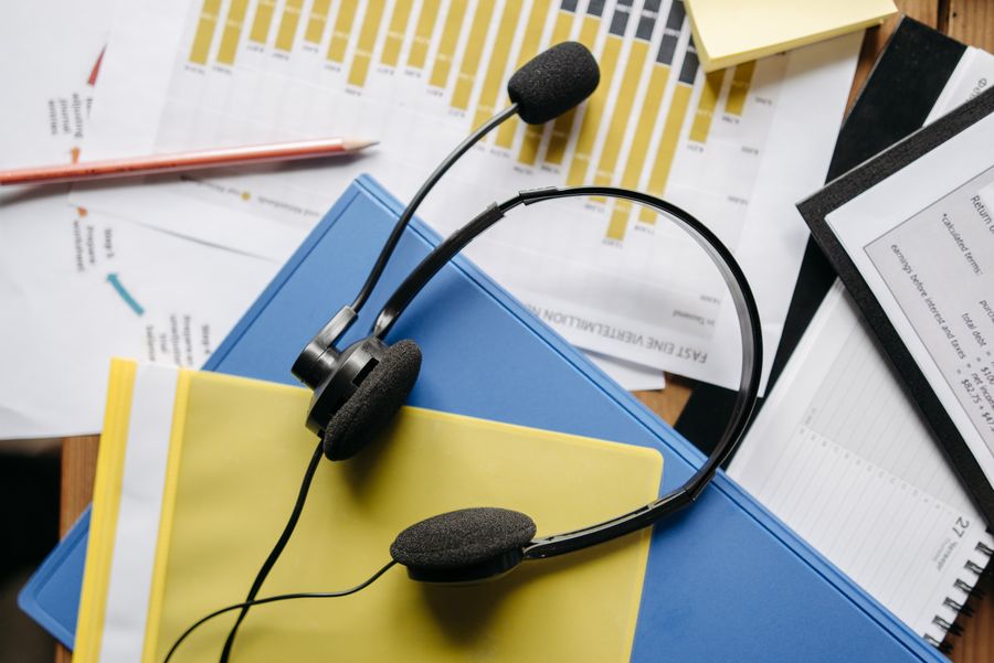a close up shot of a headset on documents — The spec grid shows exactly what How Much Speed Do You Need? accepts and what it returns.