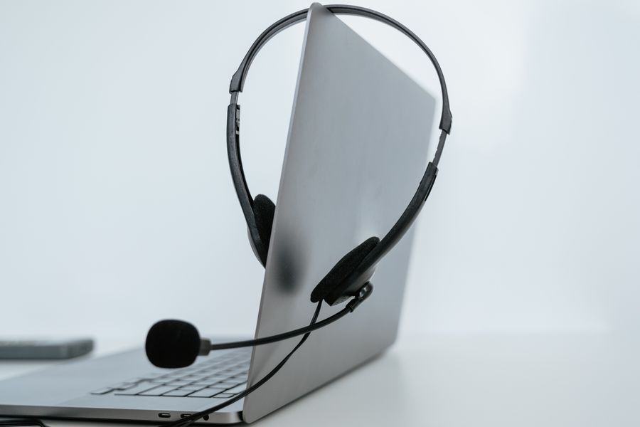 a headset on a laptop — Trailheads and lookouts: offline maps downloaded, just in case.