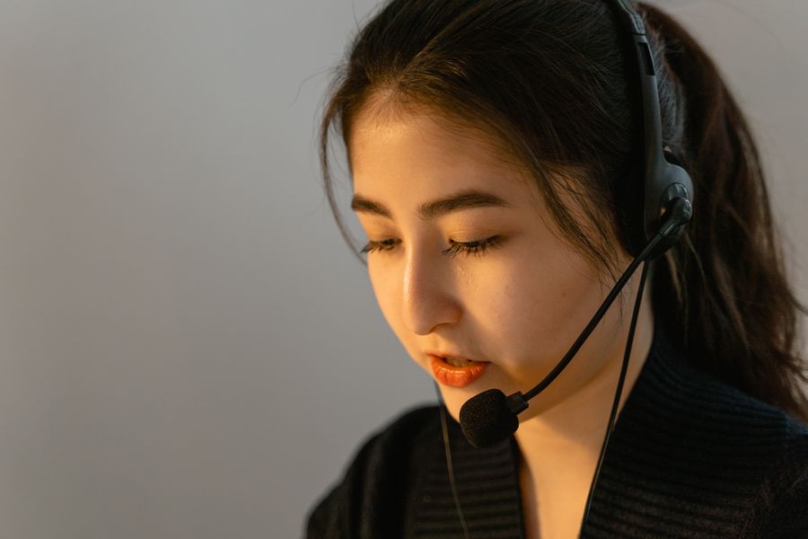 a call center agent working — Low-Data Alert: answers first, never a signup wall.