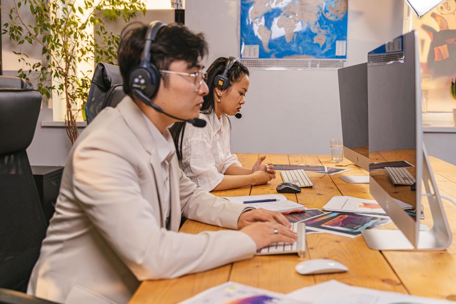 man and woman wearing a headset with a microphone in an office — The capability matrix lists everything Data-Saver Setup does — no asterisks.