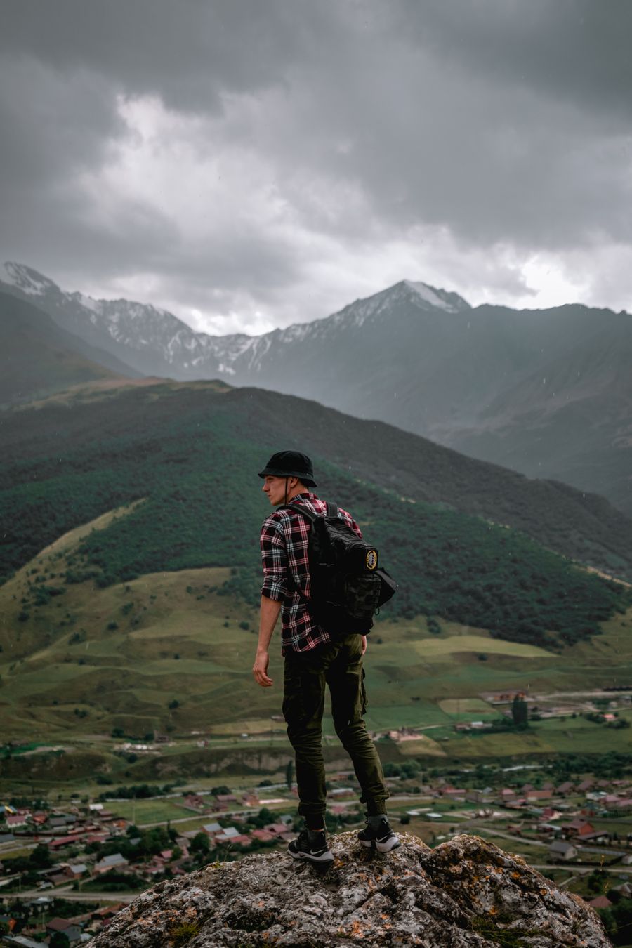 male hiker standing on the rock overlooking the green mountains — Every run of How Much Speed Do You Need? is free — no credits, no paywall, no expiring trial.